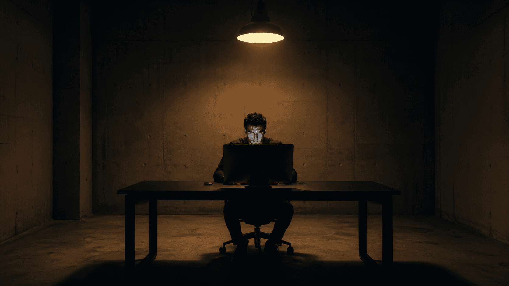 Man in a dim room in front of a city skyline at night, representing the War Room mindset